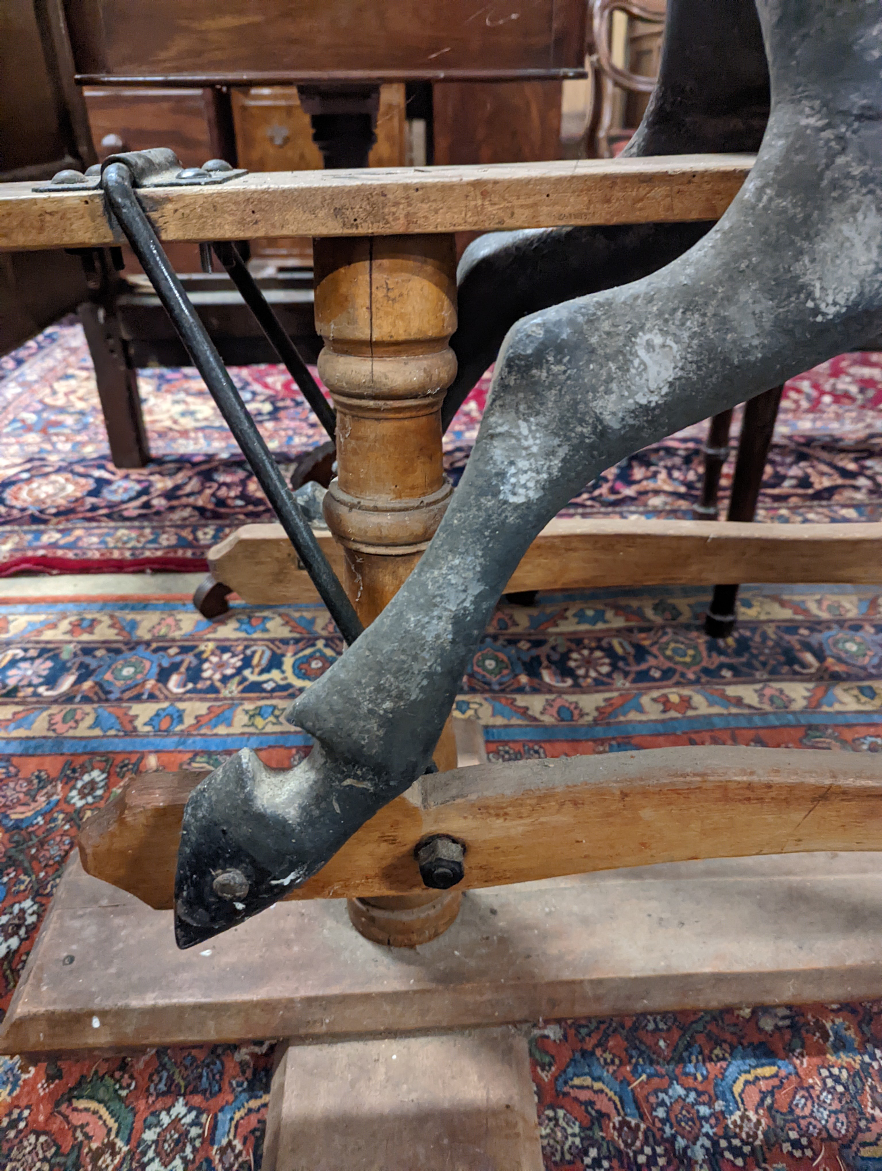 A large Edwardian Ayres type rocking horse on a turned safety frame, length 160cm, height 110cm